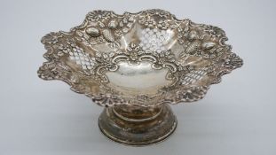 A Victorian repousse pierced silver pedestal bonbon dish by Deakin and Francis with fruit, floral