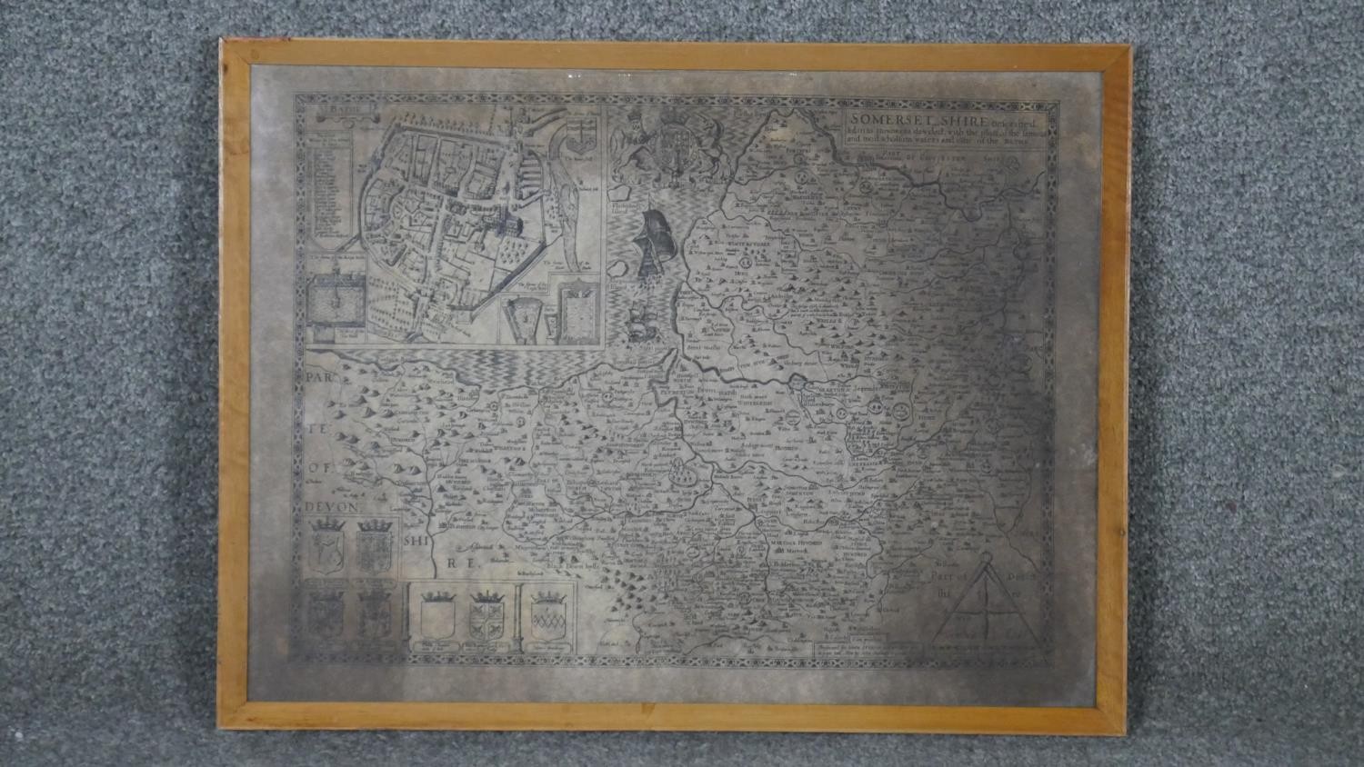 A framed and glazed atique map of Somersetshire. W.51 H.39