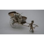 A Wai Kee Chinese novelty silver cruet set in the form of a man pulling a rickshaw, woven effect