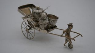 A Wai Kee Chinese novelty silver cruet set in the form of a man pulling a rickshaw, woven effect