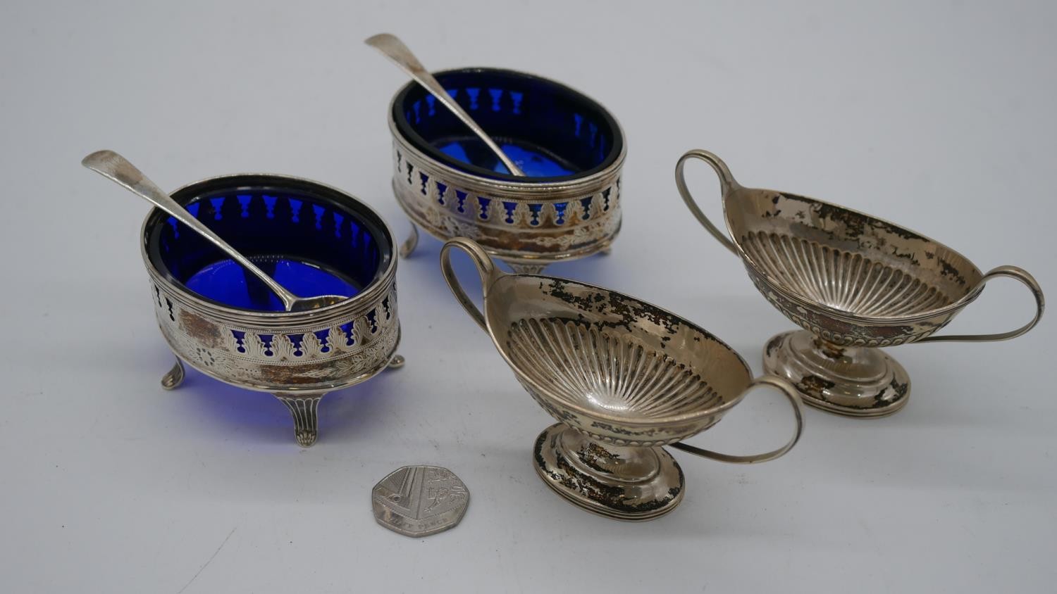 Two pairs of 19th century silver salts. One Georgian pair with blue glass liners and a pierced and - Image 2 of 9