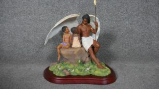 A Thomas Blackshear's figure group, Ebony Visions, Under the Shelter of his Wing, boxed.