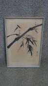 A framed and glazed Japanese ink painting of a bamboo branch with artists seal. H.47 W.32