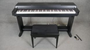 A Yahama Clavinova CLP-650 digital piano with matching stool. H.83 W.140 D.47cm (Damage to case as