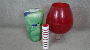 A collection of glass and porcelain. Including a large red Murano glass vase on clear stem, a