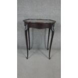 A C.1900 mahogany bijouterie table with shaped lidded top enclosing interior with original lining