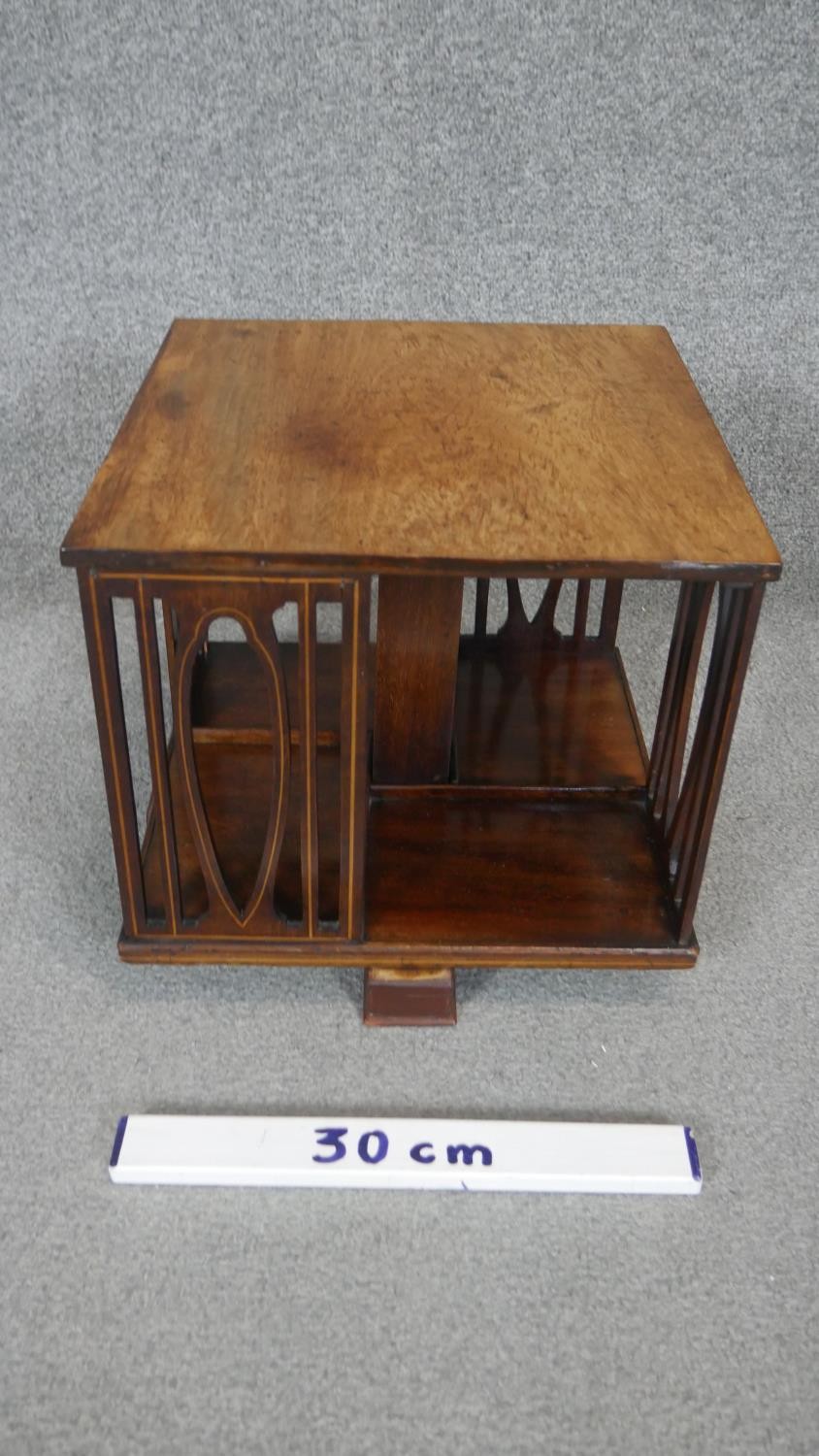 An Edwardian mahogany and satinwood inlaid revolving table top bookcase. H30 W36cm - Image 3 of 3