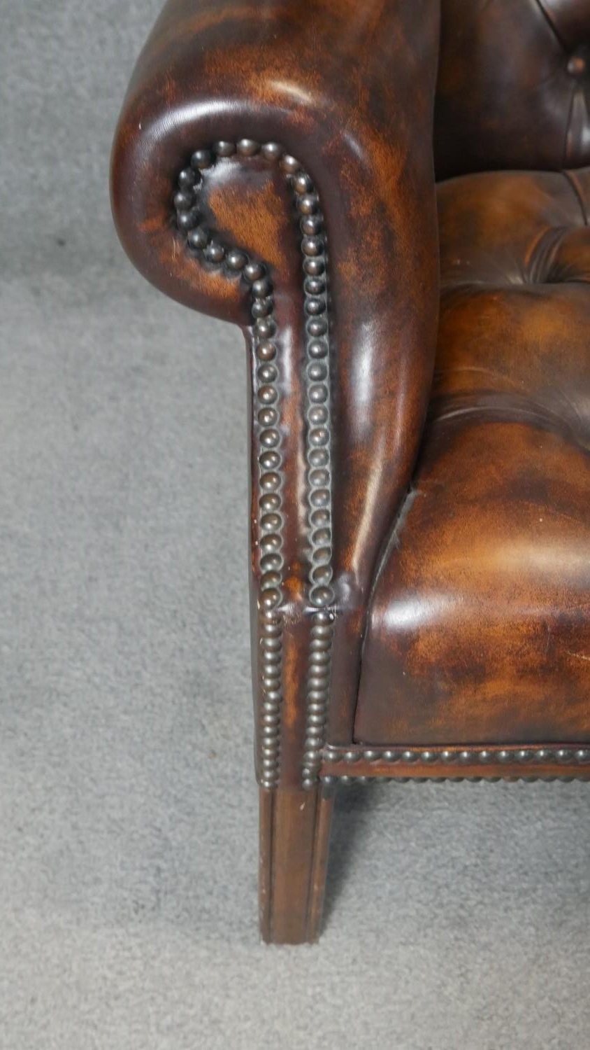 A Georgian style wingback two seater armchair in deep buttoned and studded leather upholstery on - Image 5 of 5