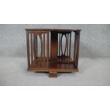 An Edwardian mahogany and satinwood inlaid revolving table top bookcase. H30 W36cm
