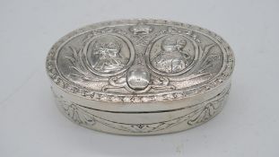 A Victorian oval repousse German hannau silver box with portraits of Marie Antoinette and Louis