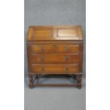 A mid century antique style oak bureau. h101 w84 d44