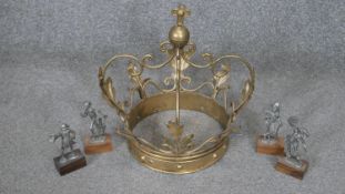 A gilt metal crown with foliate design along with a set of four Italian Peltro pewter figures on