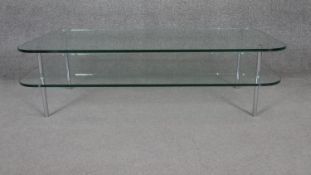 A contemporary Conran shop two tier plate glass table on tubular chromium supports. H.35 W.120 D.