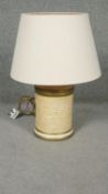 A John Lewis paper effect ceramic cylindrical table lamp with calligraphy and gilded details. Makers