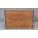 A 19th century pine trunk with twin metal carrying handles. h30 w45 d40