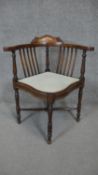 A C.1900 rosewood corner chair with floral inlaid cresting to back rail and ivory stringing to the
