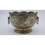 A two handled Art Deco silver pedestal bowl with geometric crenallated edge. Hallmarked: JC&D for