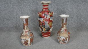 A collection of three early 20th century hand painted Japanese Satsuma ware ceramic vases, decorated