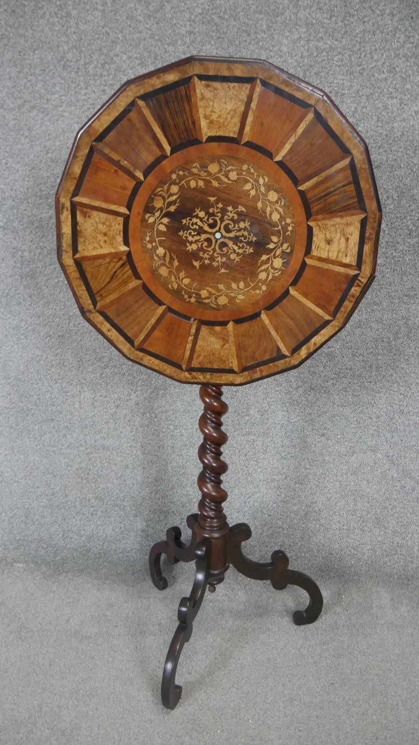 A 19th century parquetry inlaid specimen table with central floral marquetry section raised on