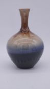 A Persian drip glazed vase with gradient design.