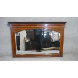 An Edwardian mahogany and satinwood inlaid overmantel mirror with hand painted ribbon, swag and