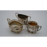 Three two handled silver sugar bowls. Two with gadrooned design, hallmarked: Birmingham, 1894 and GA