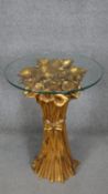 A glass topped lamp table with moulded gilt base in the form of a bunch of Calla Lillies. h66 w50