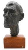 A sculpted bronze head of an elderly gentleman. Mounted on a wooden stand. Unsigned. H.45cm