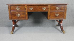 A Georgian mahogany kneehole desk with inset tooled leather top on associated base. H.75 W.140 D.