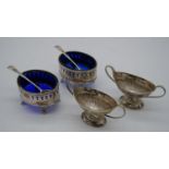 Two pairs of 19th century silver salts. One Georgian pair with blue glass liners and a pierced and