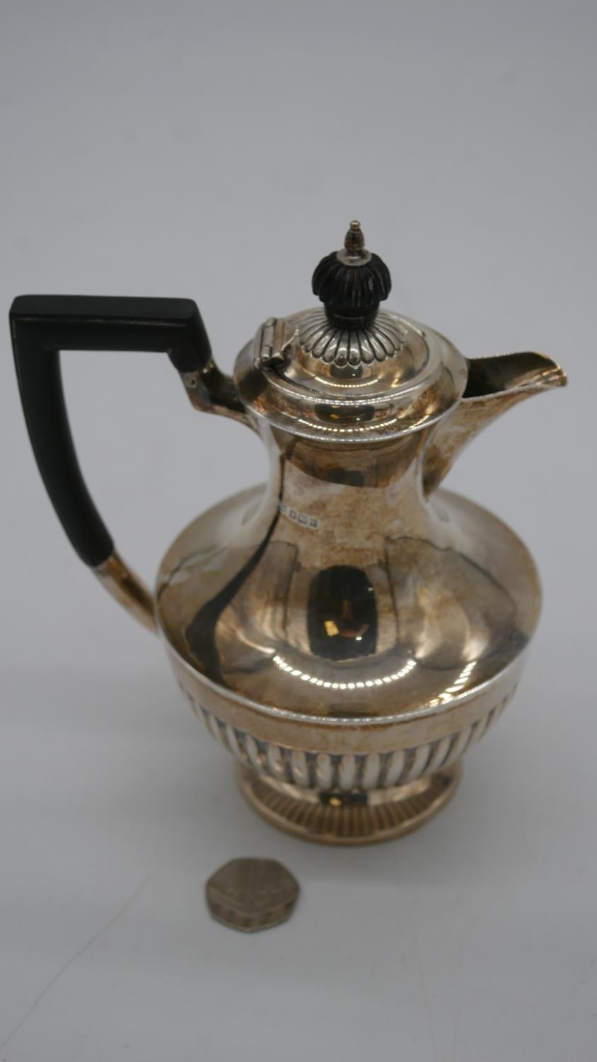 An Edwardian Mappin and Webb sterling silver gadrooned coffee pot with ebony handle. Hallmarked M&W, - Image 2 of 4