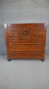 A 19th century mahogany and satinwood inlaid chest with central hat drawer on bun feet. H.123 W.1340