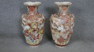 A pair of 20th century Japanese Satsuma ware hand painted vases. Decorated with figurative scenes,