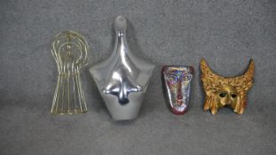 A collection of mannequins and masks. Including a vintage chrome effect clothes mannequin, a gilt