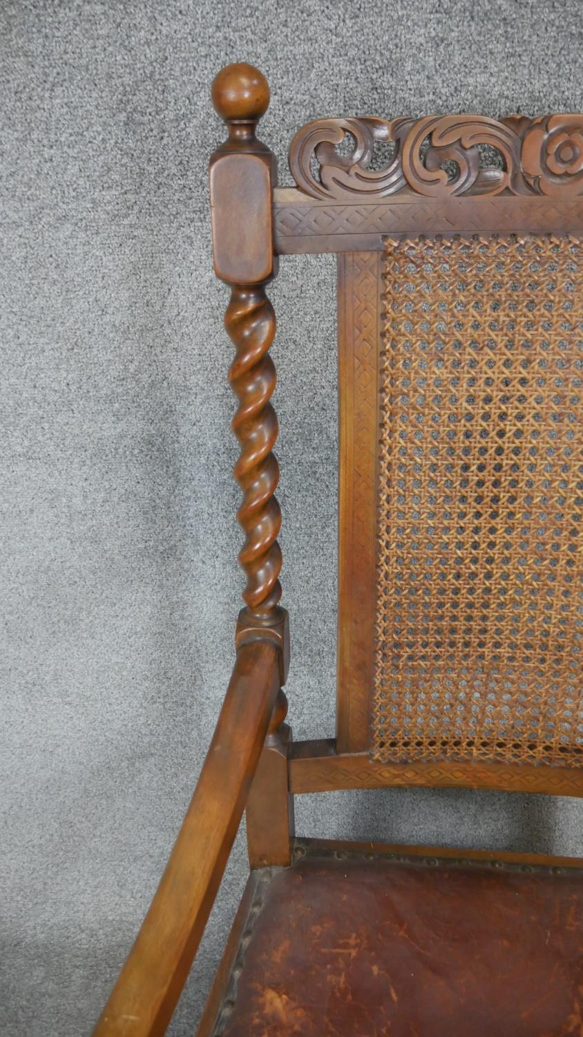 A mid century carved oak Carolean style armchair with caned back and leather seat on barleytwist - Image 3 of 3