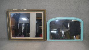 A gilt framed wall mirror along with a painted Victorian arched overmantel mirror. H.88 W.103cm (