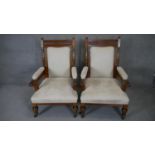 A pair of late 19th century newly upholstered carved oak armchairs on reeded bulbous supports. h110
