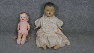 Two vintage dolls. A vintage composition doll by DEE and CEE, Canada in a night dress along with a
