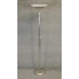 A contemporary metal uplighter with frosted shade. H.182cm