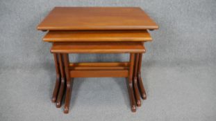 A nest of three vintage teak occasional tables. H.48 W.58 D.43cm