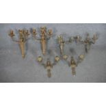 A pair of Adam style gilt metal twin branch wall lights along with a set of four similar wall