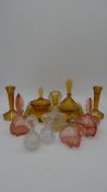 A collection of Art Deco glass perfume bottles and two dressing table sets, one in amber glass.