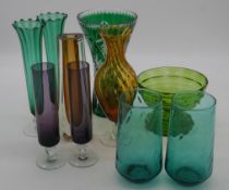 A collection of vintage coloured glass. Including a Bohemian emerald cut to clear vase, two pairs of