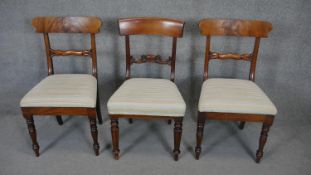 A pair of 19th century bar back dining chairs and a similar chair all in the same upholstery.