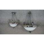 A metal framed ceiling light with domed frosted shade and a similar smaller example. H.70 W.70cm (