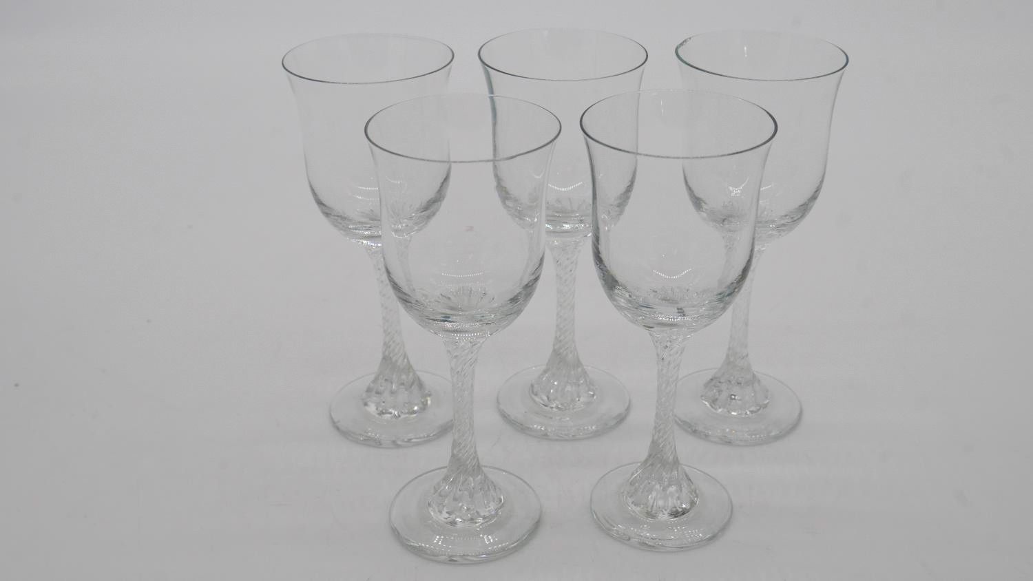 A set of five Victorian twist stem clear sherry glasses with flared rims. - Image 2 of 3