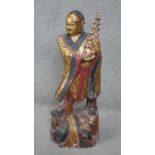 A large early 20th century East Asian carved gilded and painted wooden buddha statue. With