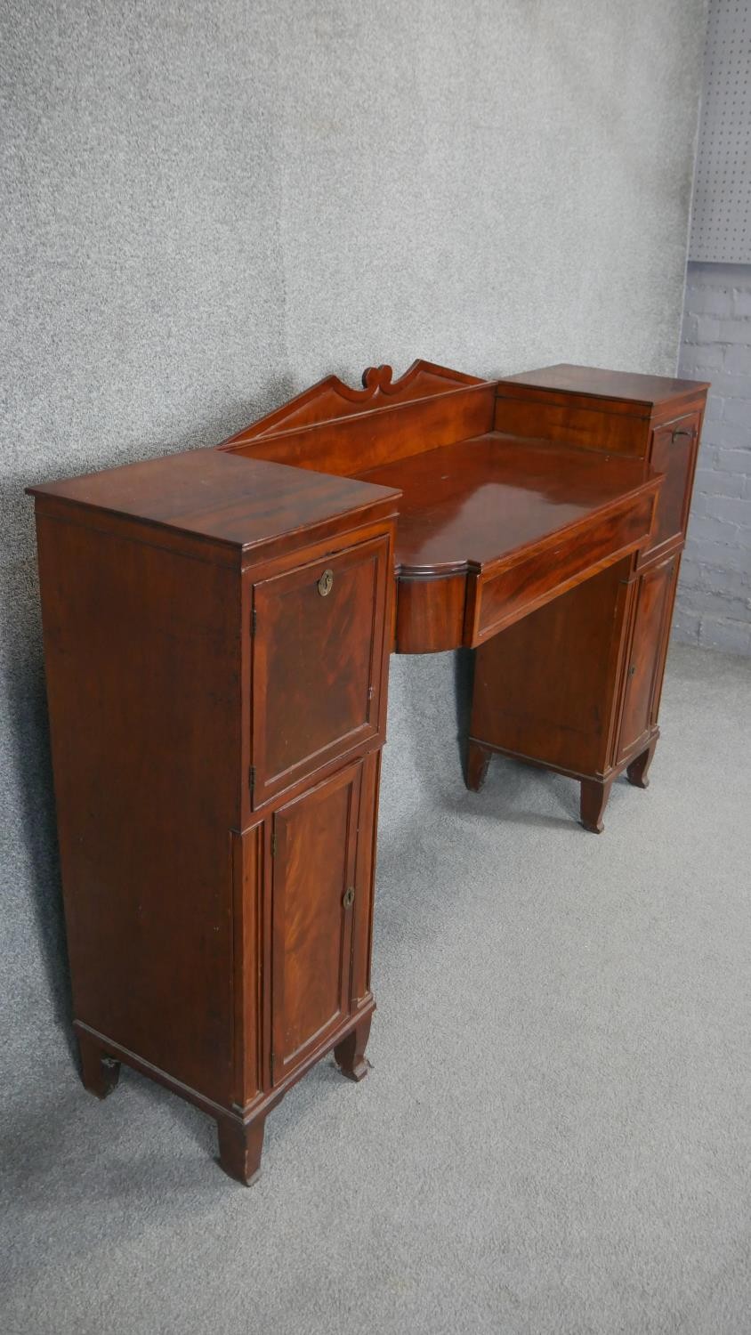 A Regency mahogany twin pedestal sideboard with flame mahogany panel doors flanked by pilasters on - Image 2 of 5