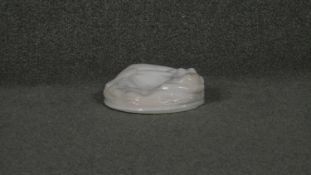 An Art Deco opaque glass mermaid dish with relief design.