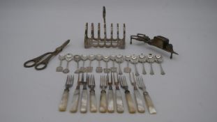 A collection of silver and silver plate. Including a pair of silver grape scissors, a silver